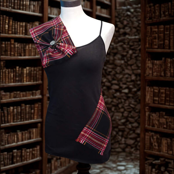 Black dress with plaid accents on a mannequin in a library setting